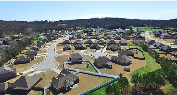 A neighborhood development with nice homes and well-maintained lawns in Church Hill Downs, Priceville, AL.