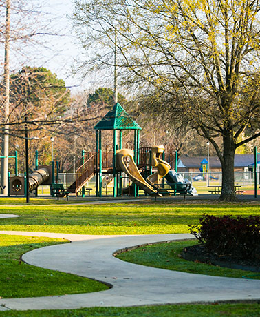 A children's playground with slides, tunnels, and other features in a Veterans Park in Priceville, AL.