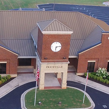A drone view of the front entrance of Priceville's brick City Hall building.